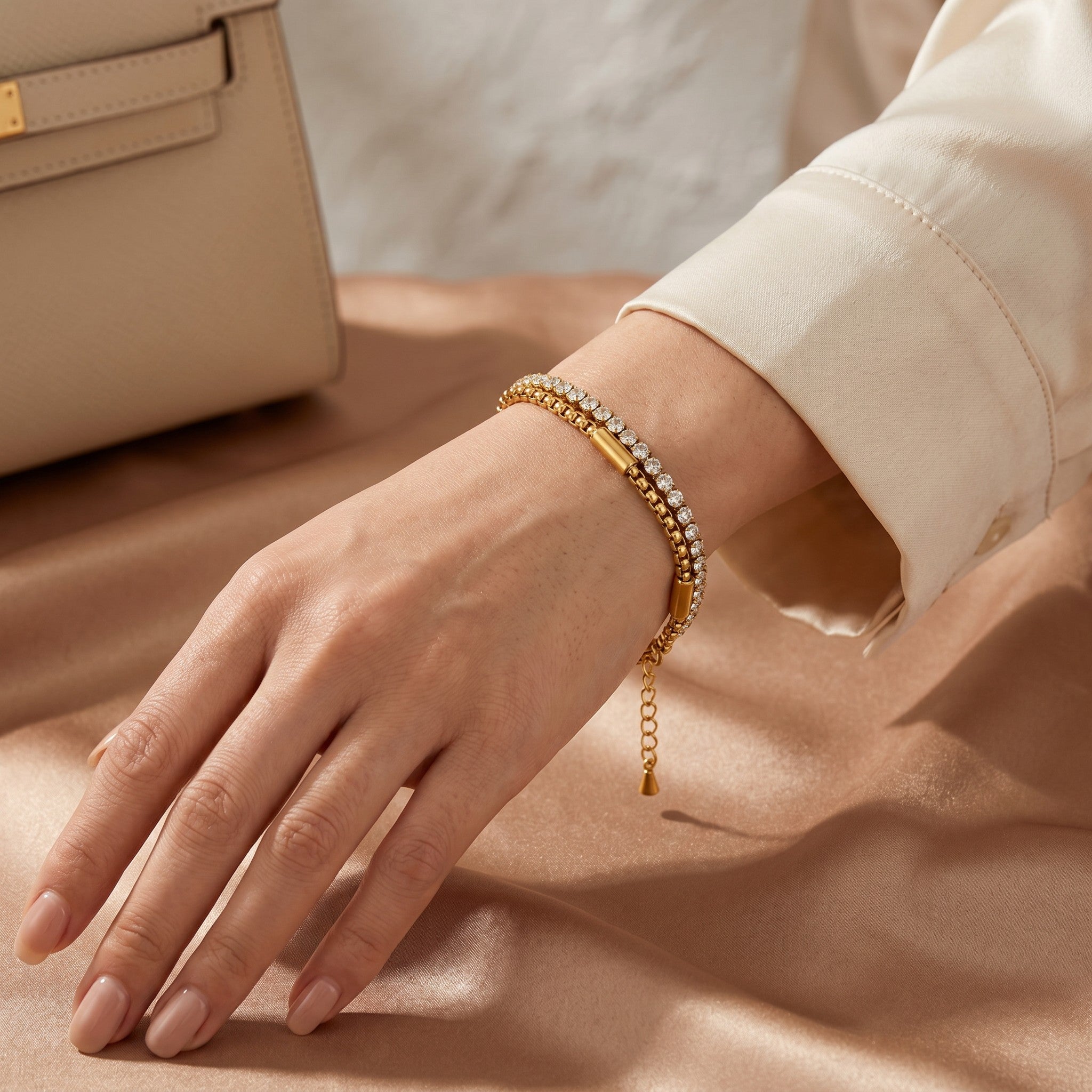 Złota Kraków double tennis bracelet with cubic zirconia on a woman's wrist, made of 18K gold-plated surgical steel.