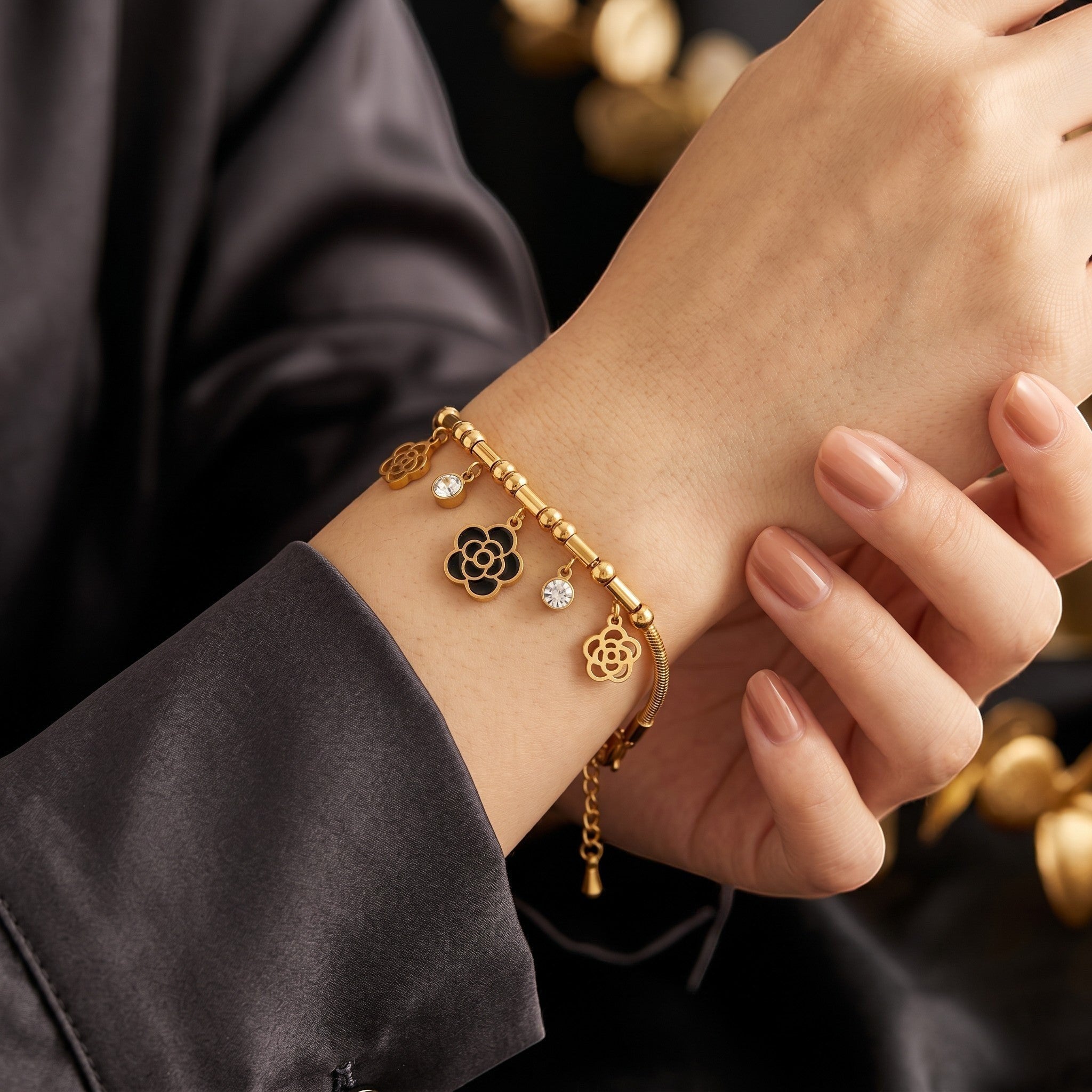 Złota Kraków gold-plated surgical steel bracelet with black rose charms and clear crystal accents.