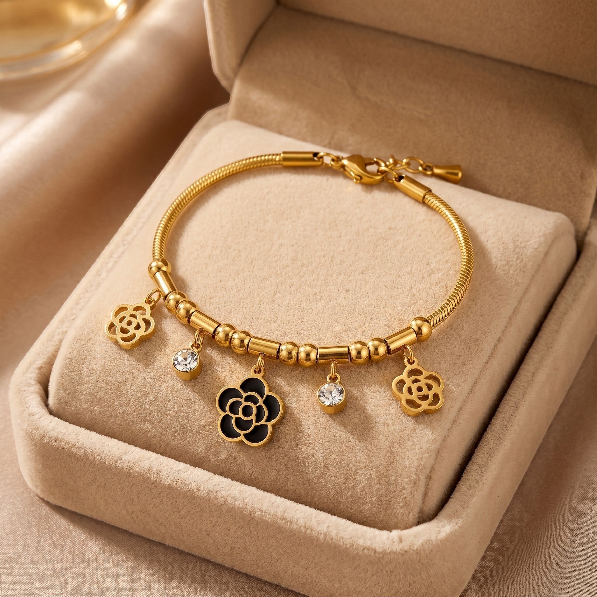 Złota Kraków gold-plated surgical steel bracelet with black rose and crystal charms. 17cm + 3cm adjustable.