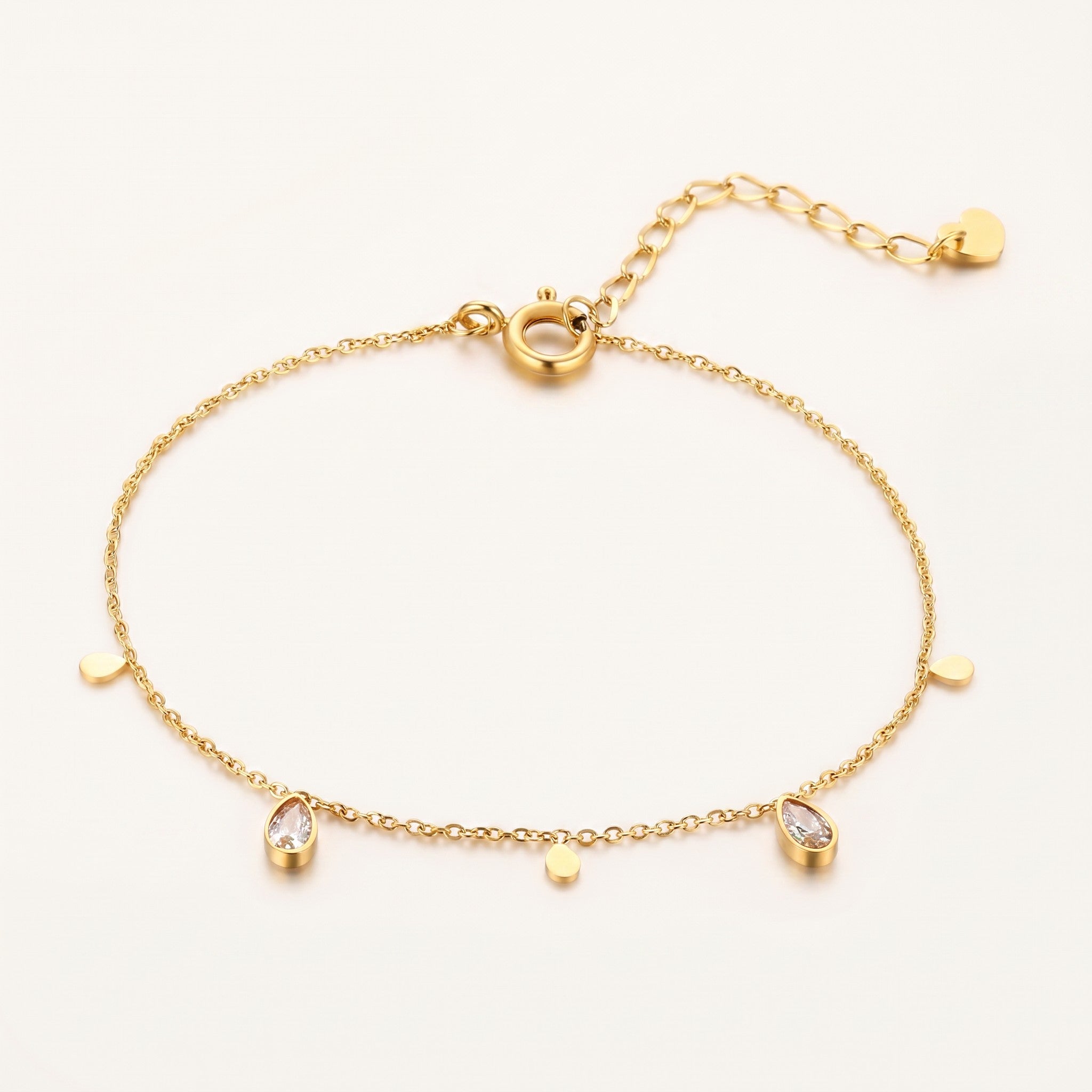 Złota Kraków delicate gold-plated surgical steel bracelet with teardrop clear crystals and small gold discs.