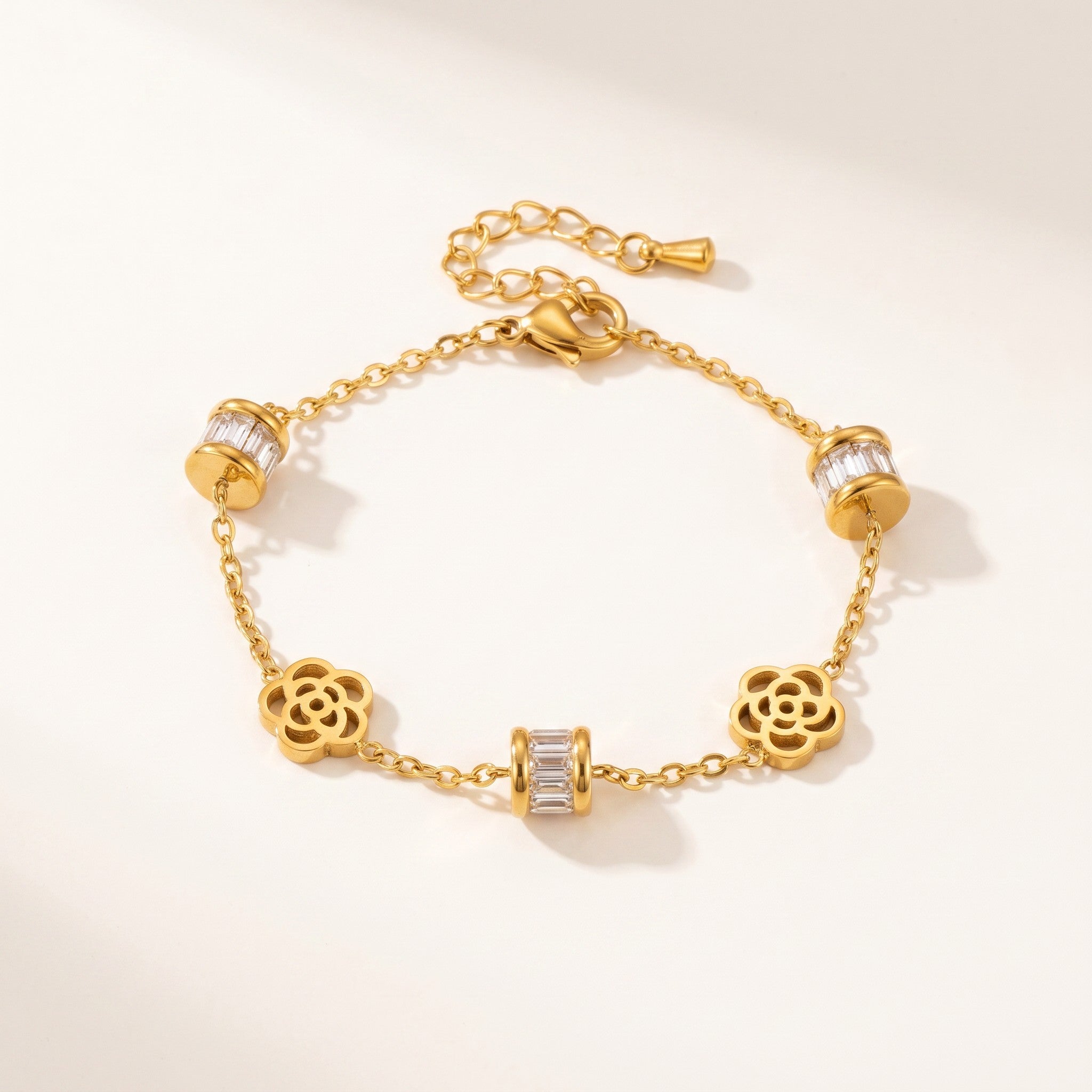 Złota Kraków gold-plated surgical steel bracelet with flower charms and baguette crystal accents.