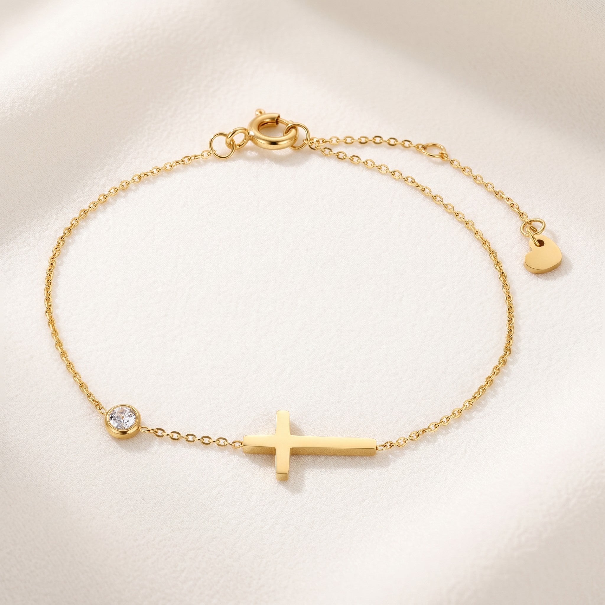 Złota Kraków classic gold-plated stainless steel bracelet with a cross charm and a cubic zirconia accent.