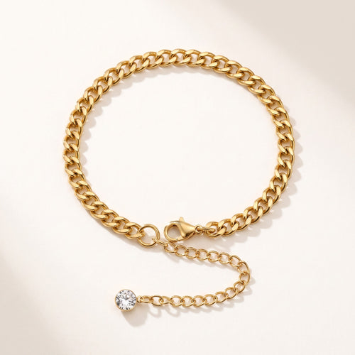 Złota Kraków gold-plated surgical steel curb chain bracelet with adjustable length and a single clear crystal accent.