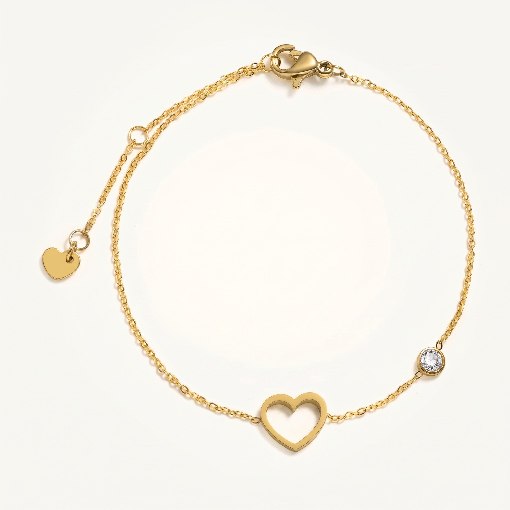 Złota Kraków gold-plated stainless steel bracelet with a heart charm and a clear crystal accent. Adjustable length.