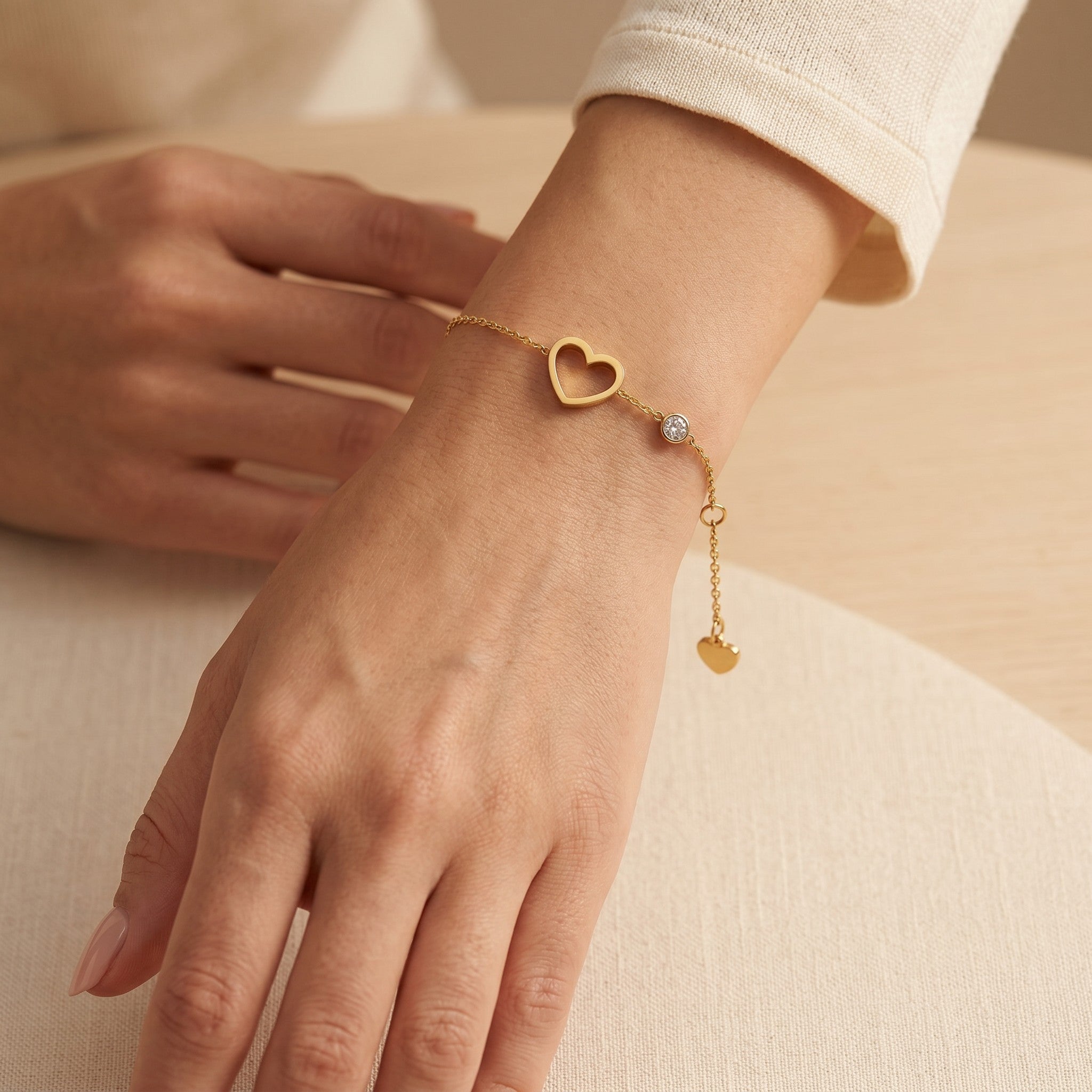 Złota Kraków gold-plated surgical steel bracelet with a heart charm and a small crystal accent.
