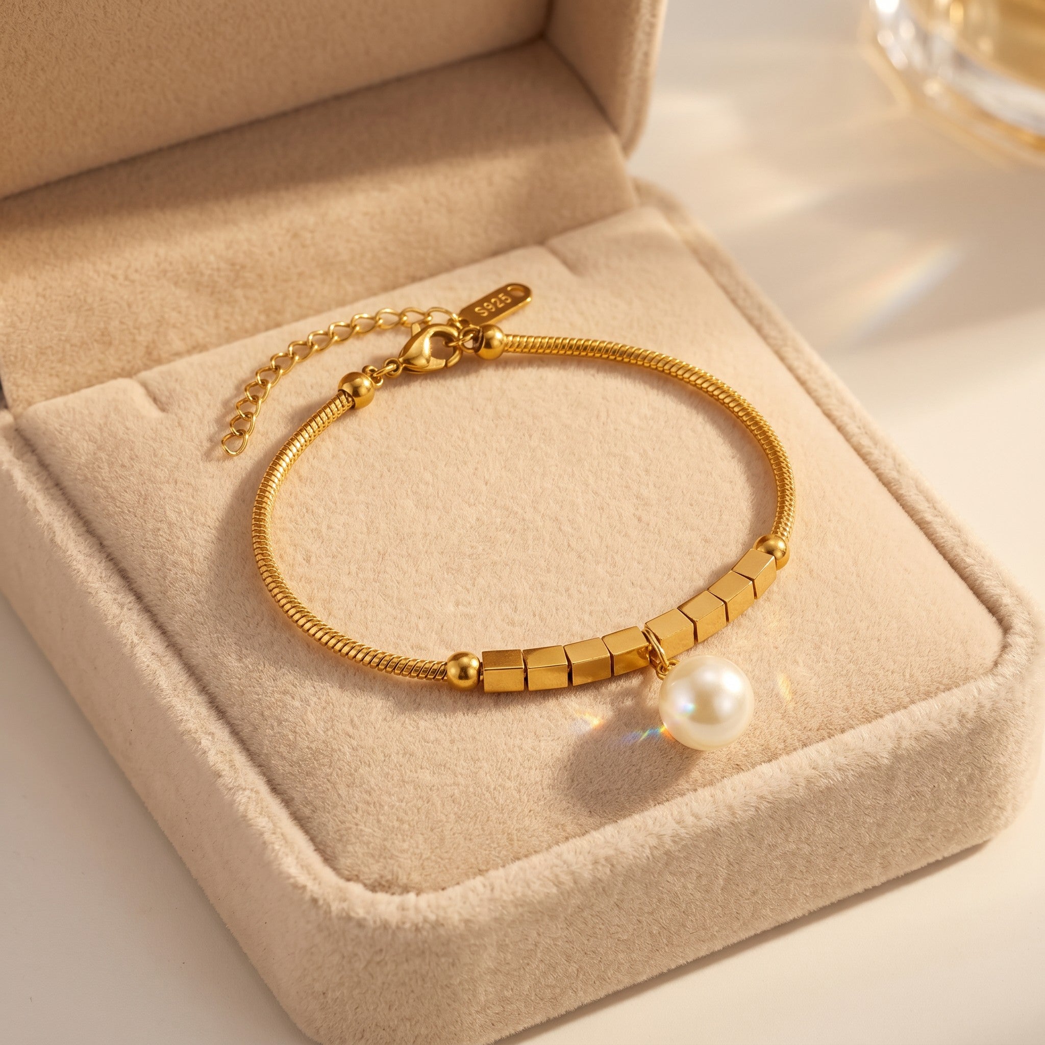 Złota Kraków gold-plated surgical steel bracelet with synthetic pearl and cube accents, 17cm + 3cm adjustable.