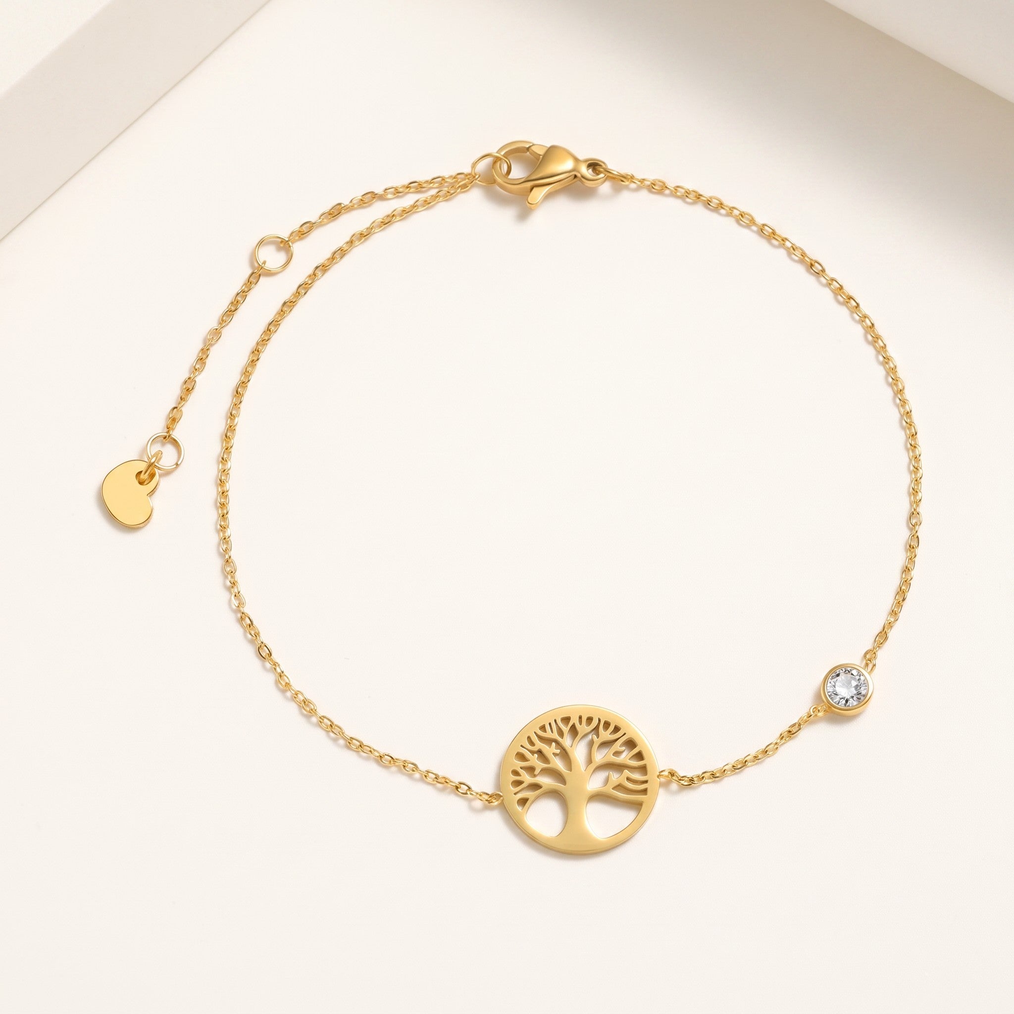 Złota Kraków gold-plated surgical steel bracelet with tree of life charm and clear crystal accent.