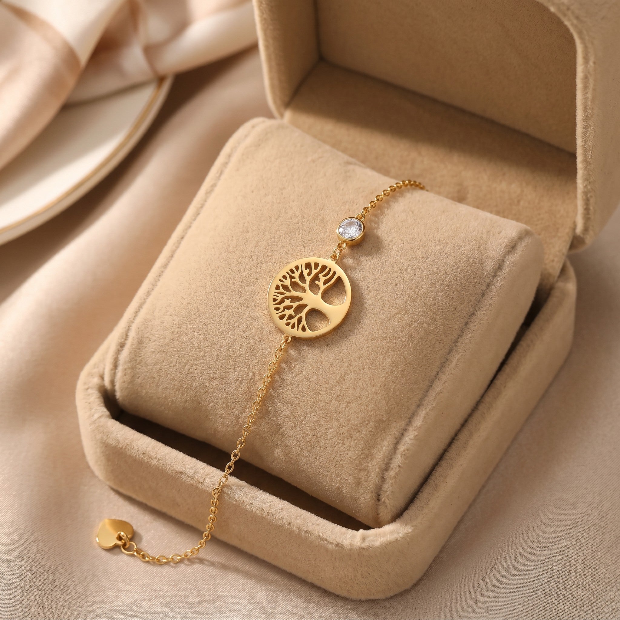 Złota Kraków gold-plated surgical steel bracelet with a tree of life charm and a clear crystal accent.