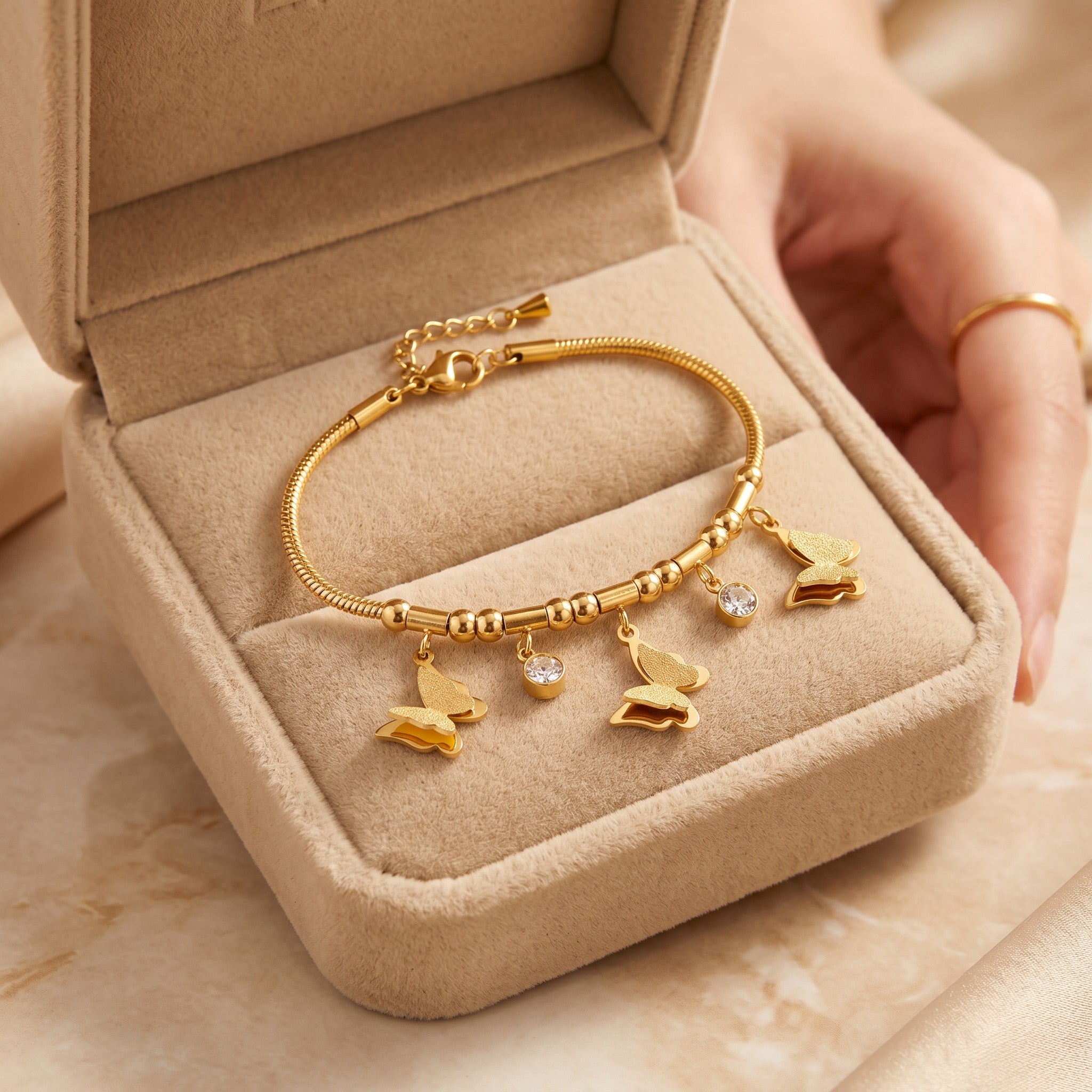 Złota Kraków gold-plated surgical steel bracelet with butterfly charms and clear crystals. 17cm + 3cm adjustable.