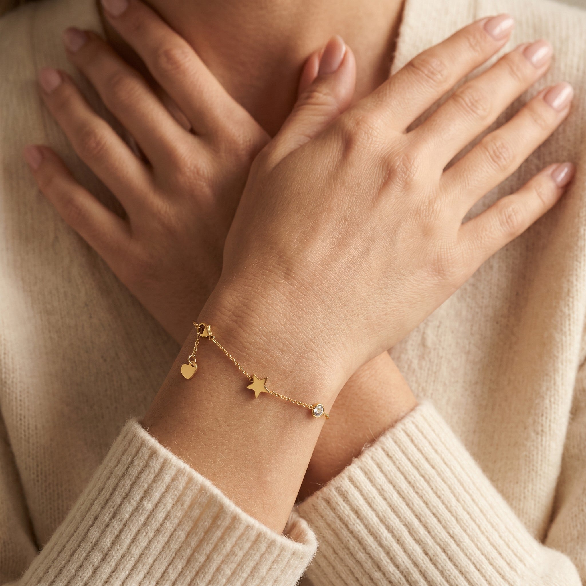 Złota Kraków gold-plated surgical steel chain bracelet with heart, star, and crystal charms.