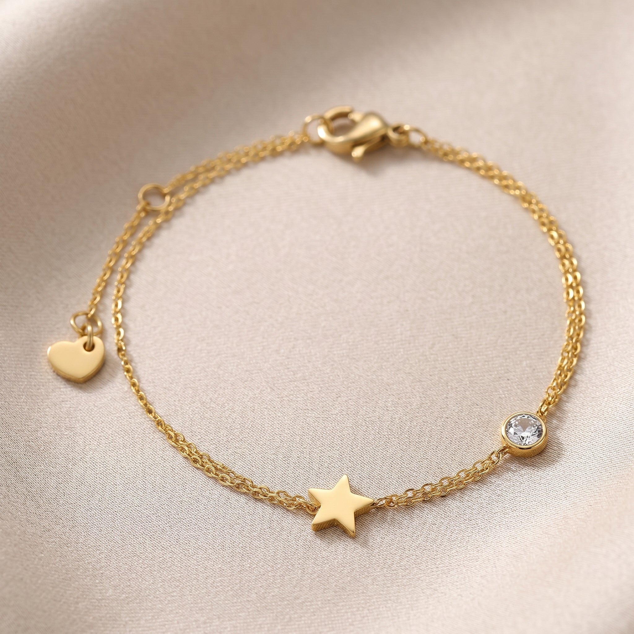 Złota Kraków gold-plated surgical steel double chain bracelet with star charm and cubic zirconia accent.
