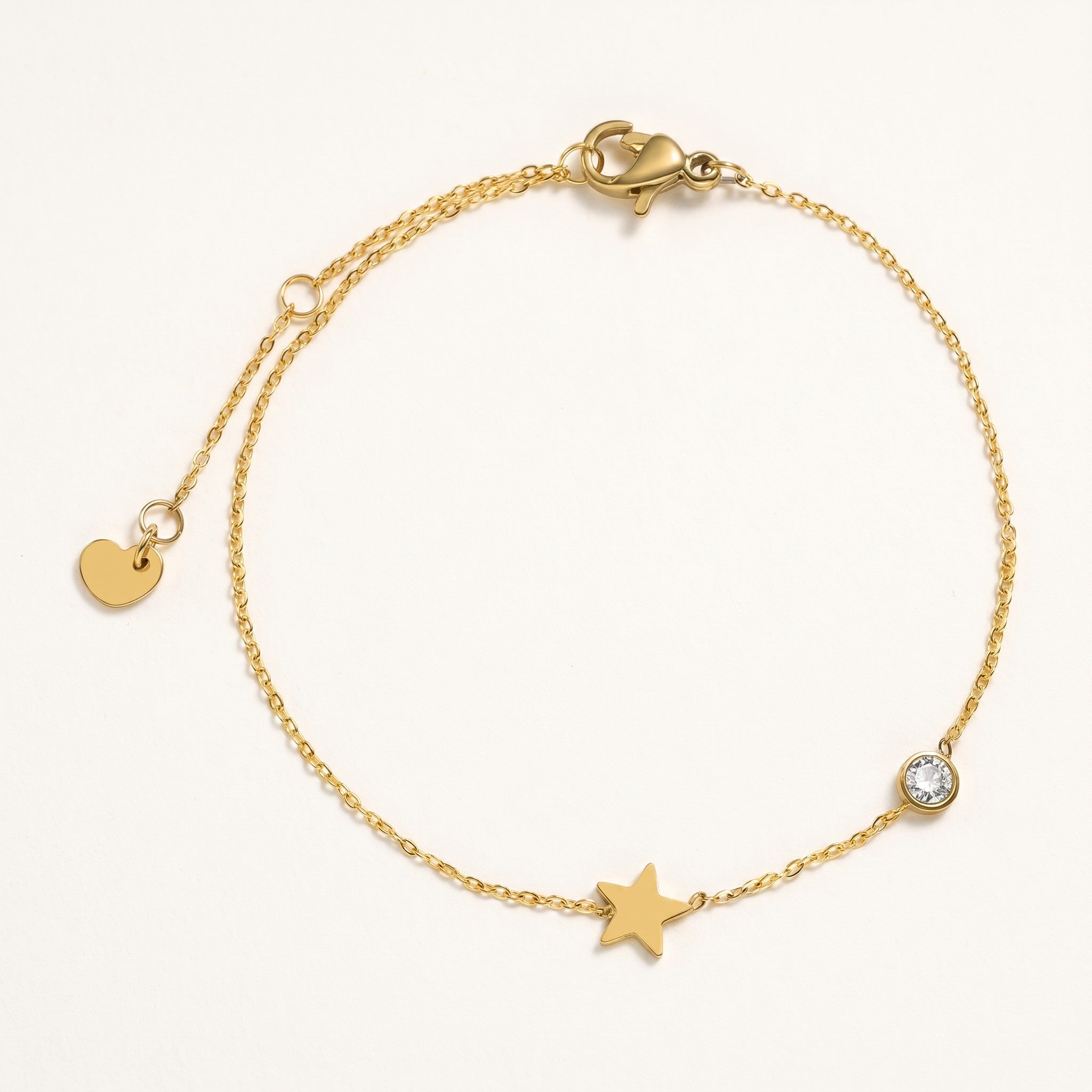 Złota Kraków gold-plated surgical steel chain bracelet with star charm and clear crystal accent. Adjustable length.